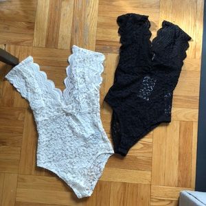 Two lace body suits